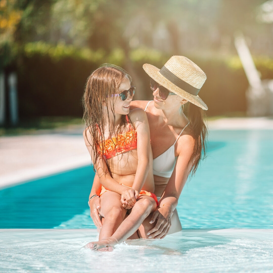 mother and daughter in plunge pool
